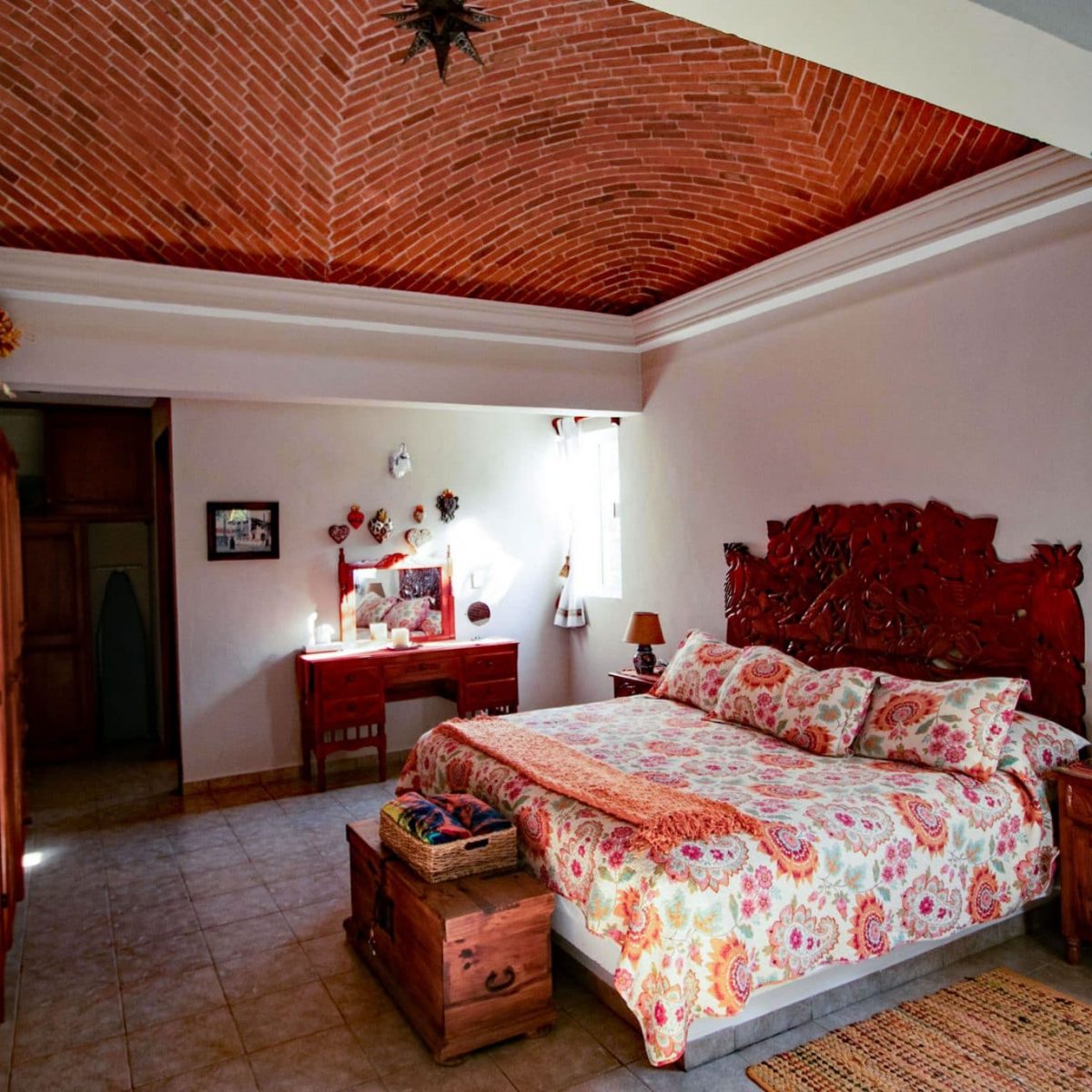 Villa Jardin, La Sirena #16, the roomy upstairs master bedroom has a handcarved headboard
