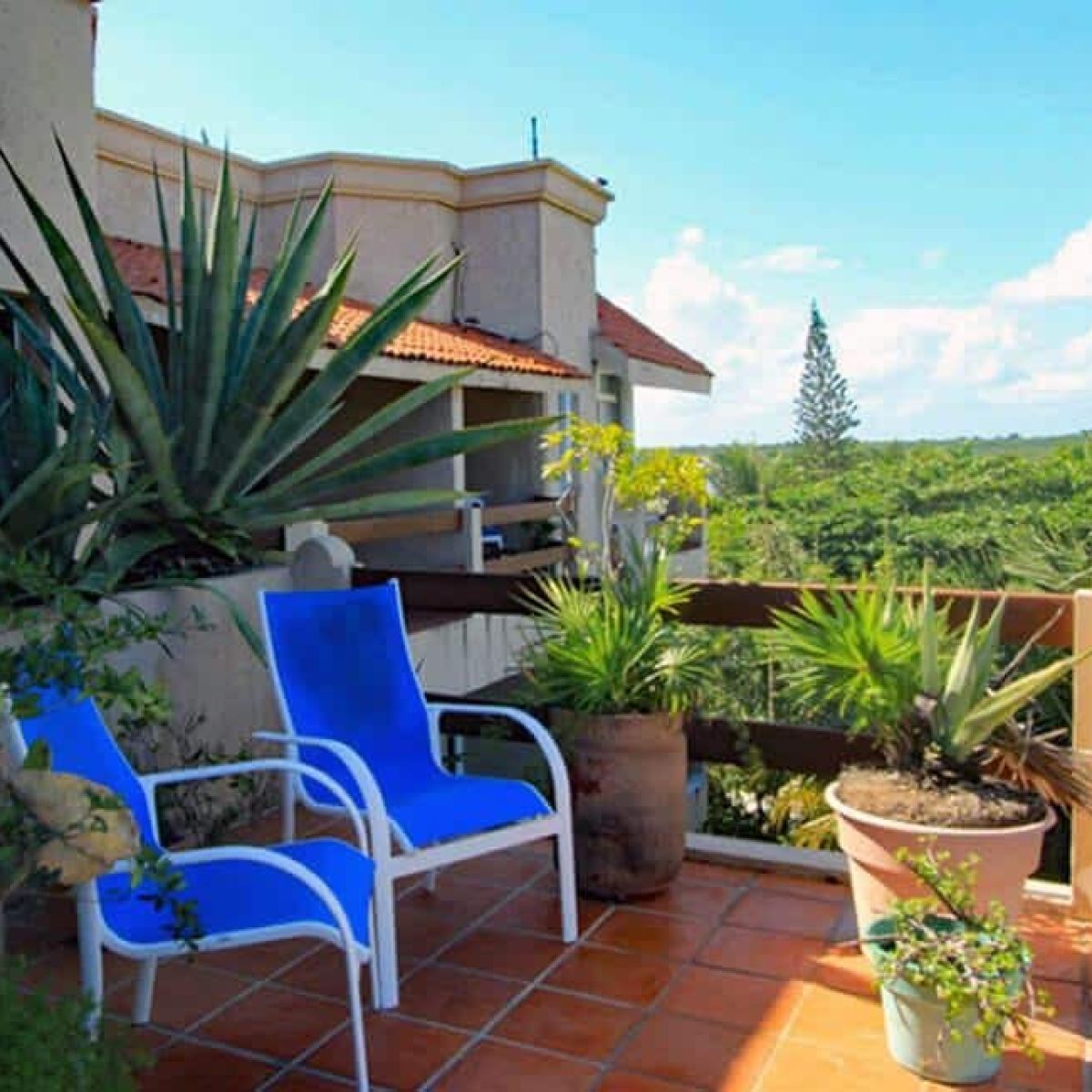 Azul Cielo, La Sirena #12, the garden patio has seating and penthouse views of the Riviera Maya jungle even to Yal-Ku